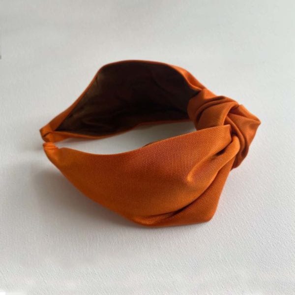Terracota Headbands by Moonkaii laid on a surface